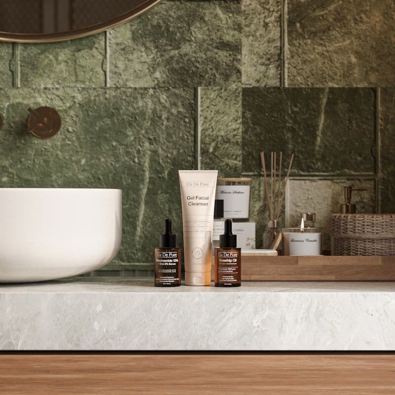 Premium skincare and massage oils on a marble counter